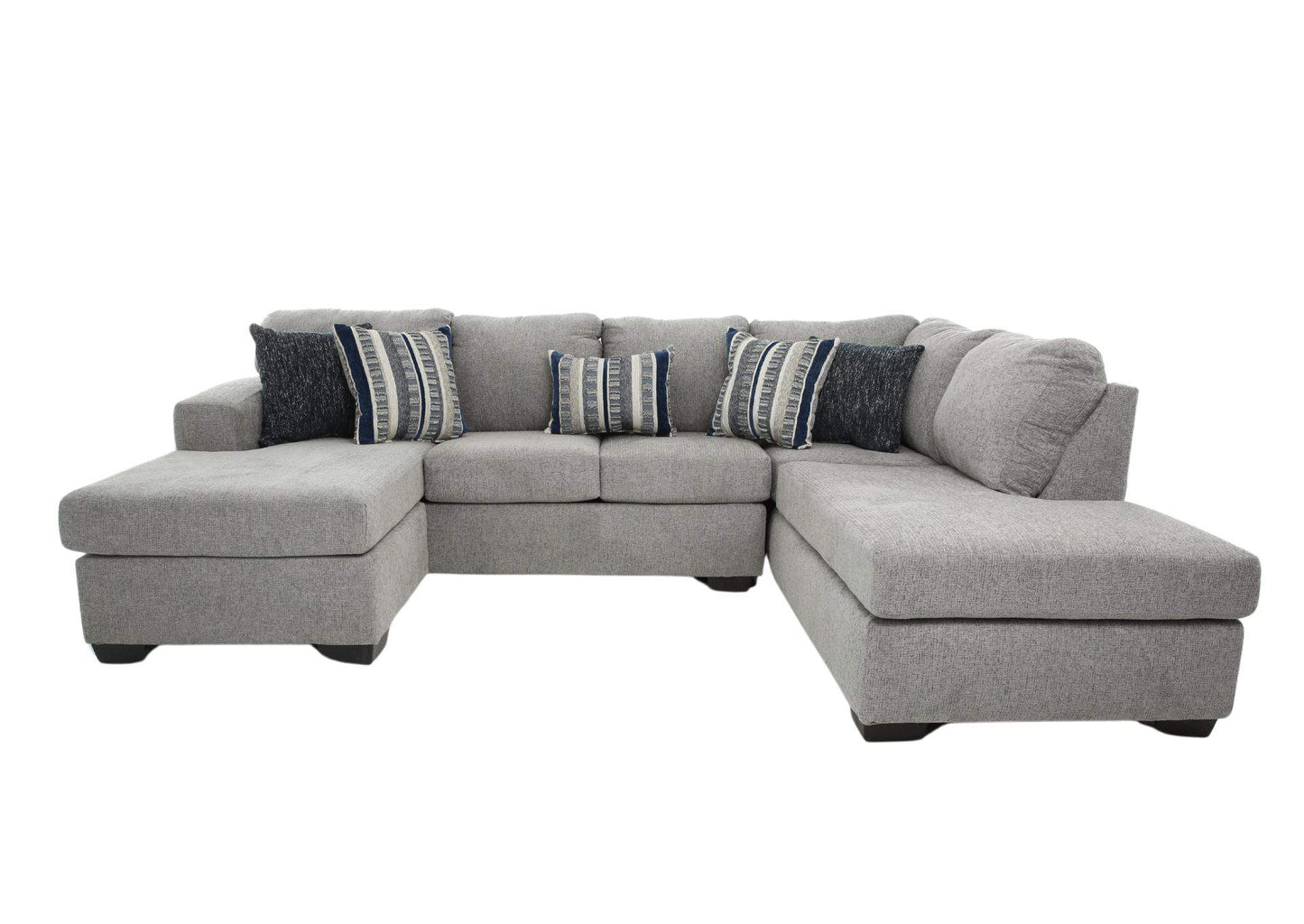 Gray sectional sofa with patterned cushions on a white background