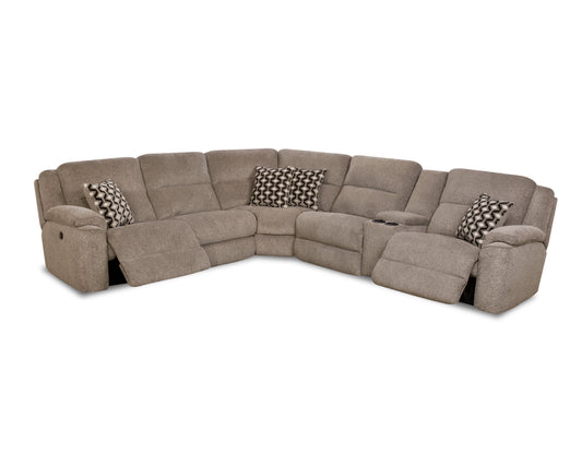 Brown sectional sofa with patterned cushions on a white background