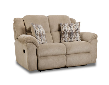 Beige reclining sofa with patterned cushions on a white background