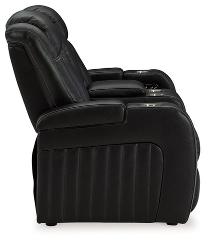 Caveman Den - Power Reclining Loveseat with Console/ Adj Hdrst - Midnight