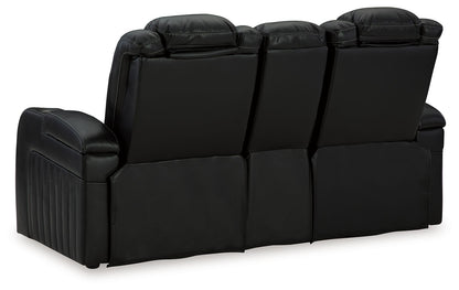 Caveman Den - Power Reclining Loveseat with Console/ Adj Hdrst - Midnight