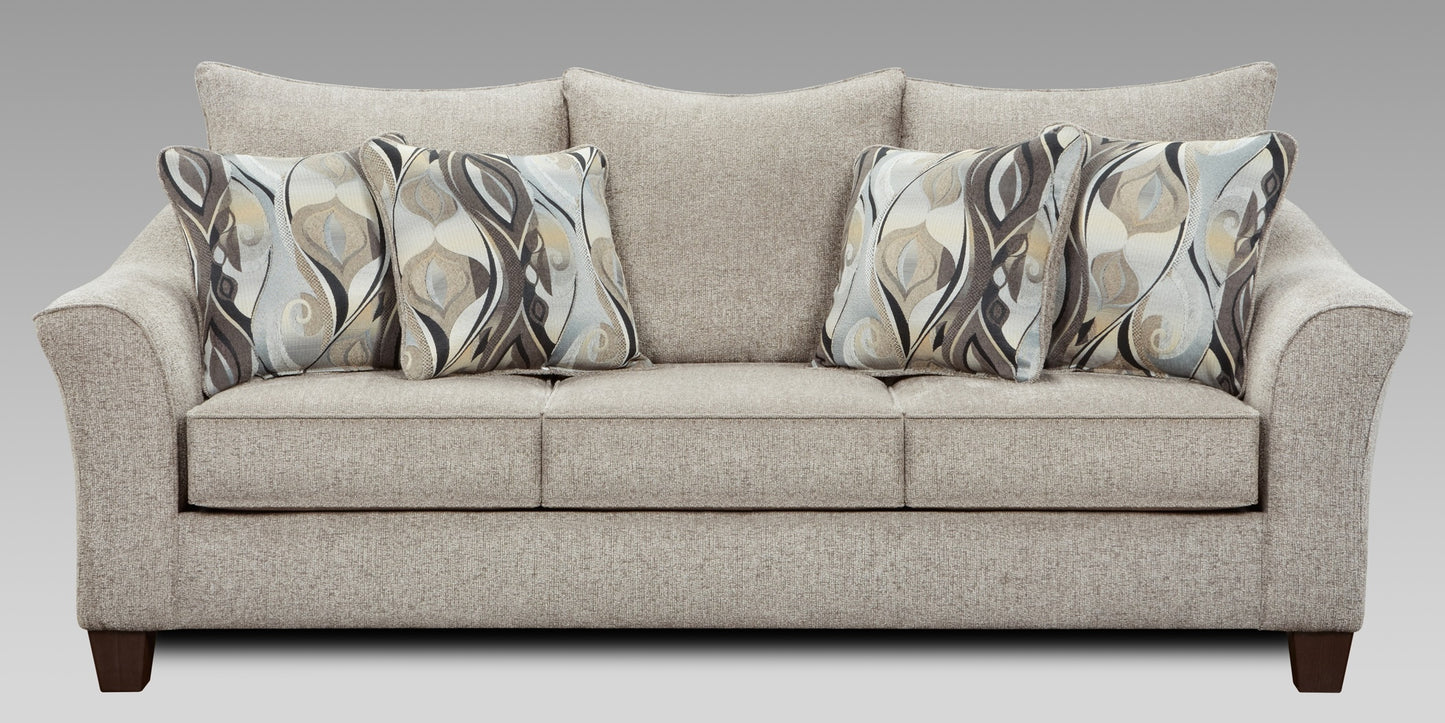Beige sofa with patterned cushions on a gray background