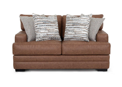 Brown sofa with patterned cushions on a white background