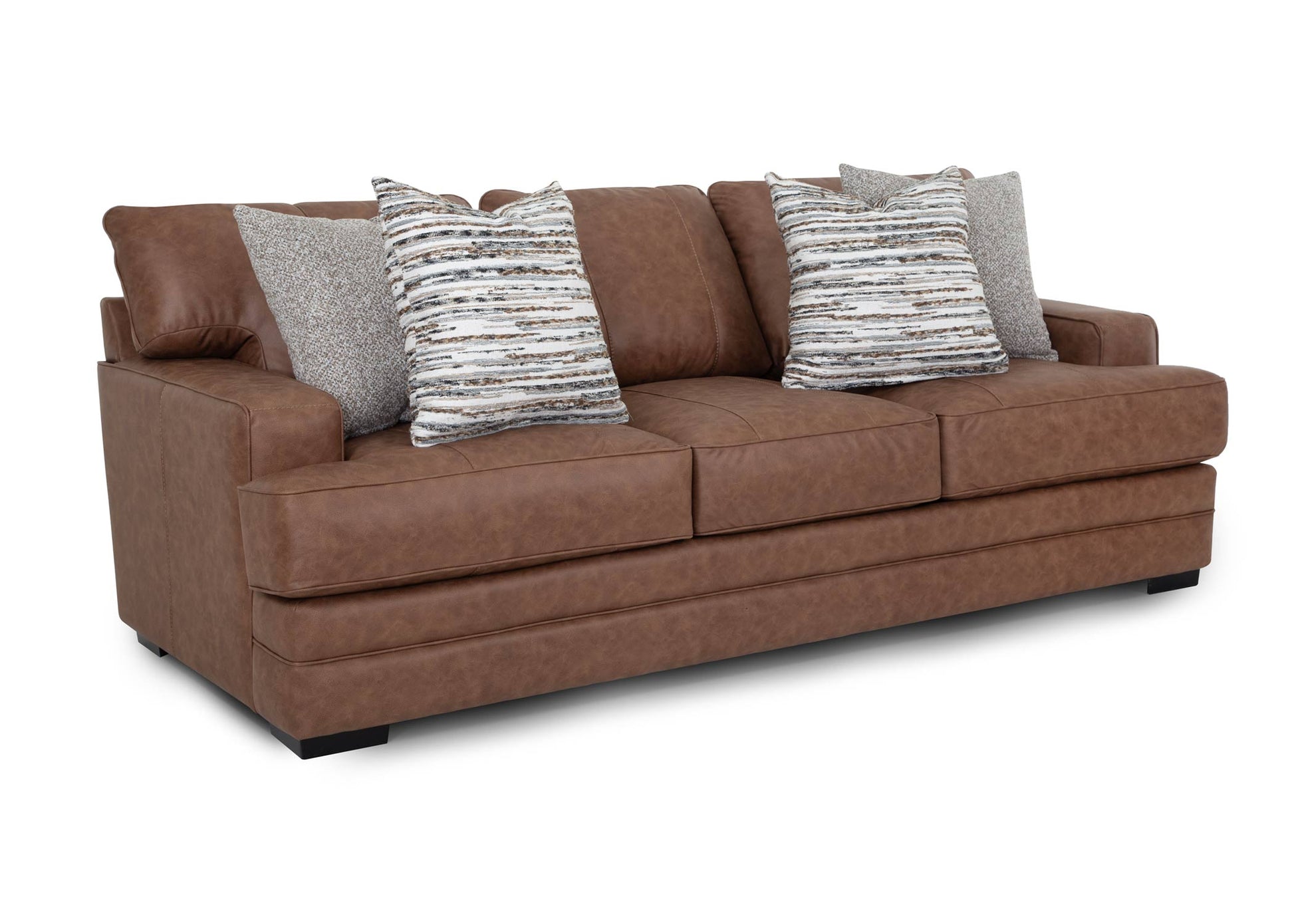 Brown sofa with patterned cushions on a white background. Angled
