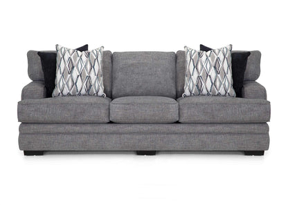 Gray sofa with patterned cushions on a white background