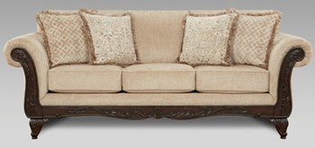 Beige sofa with decorative pillows on a plain background