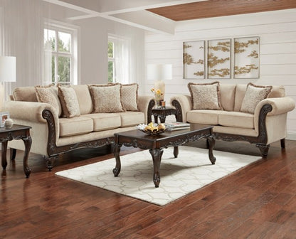 Beige sectional sofa with dark wood frames in a living room setting.