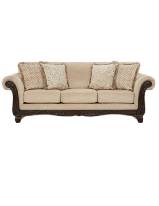 Beige sofa with decorative cushions on a white background