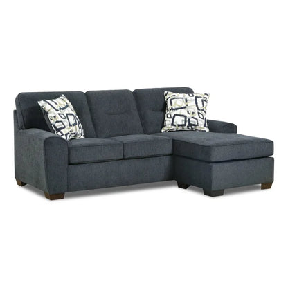 Gray sectional sofa with patterned cushions on a white background