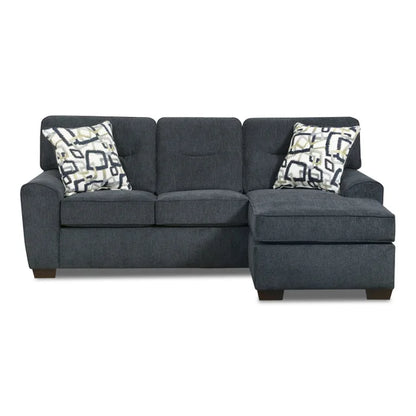 Gray sectional sofa with patterned cushions on a white background