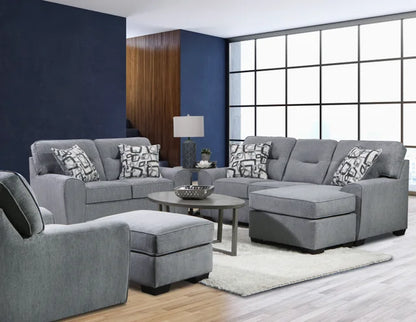 Gray sofa set with patterned cushions in a living room setting.