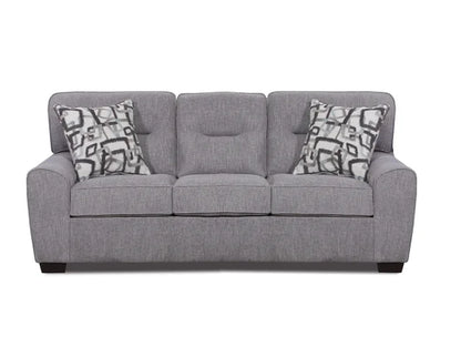 Gray sofa with patterned cushions on a white background