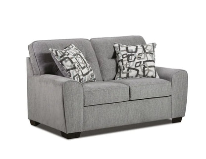 Gray sofa with patterned cushions on a white background