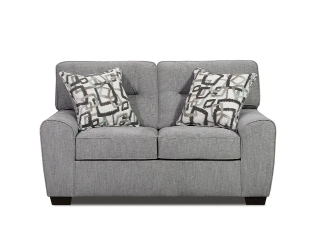 Gray sofa with patterned cushions on a white background