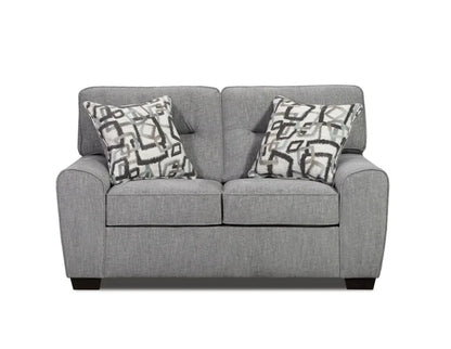 Gray sofa with patterned cushions on a white background