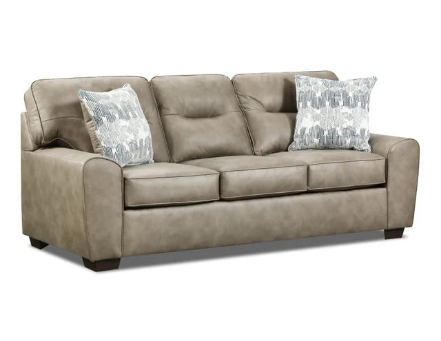 Beige sofa with patterned cushions on a white background