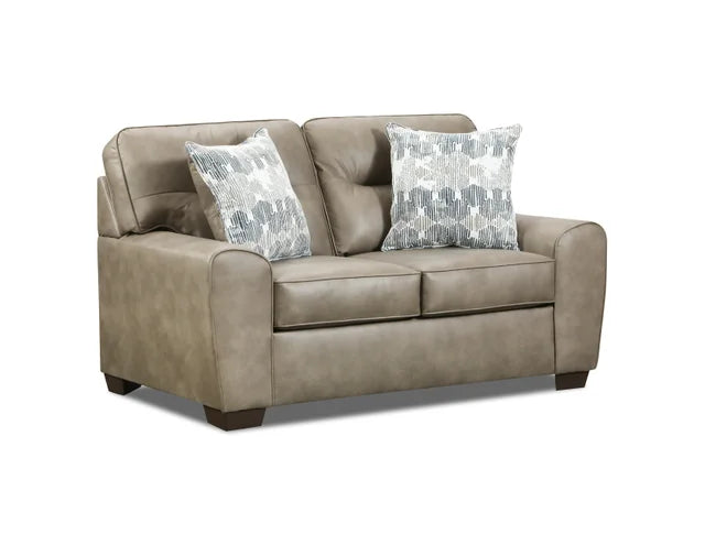 Beige sofa with patterned cushions on a white background