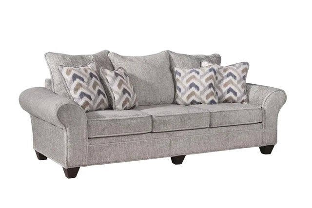 Gray sofa with patterned cushions on a white background
