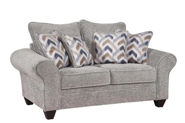 Gray sofa with patterned cushions on a white background