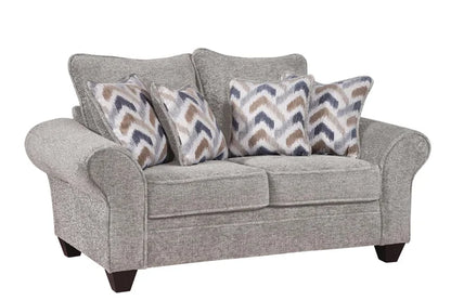 Gray sofa with patterned cushions on a white background