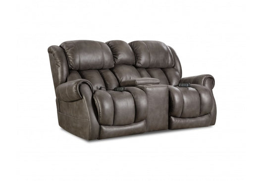 Power reclining loveseat with console, plush chaise seating, adjustable headrest, lumbar support.