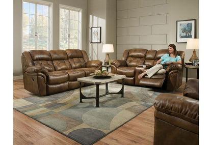 A room with a brown sofa, a girl sitting on a loveseat, and a brown rocker recliner