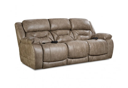 A brown, plush, padded reclining sofa with a power headrest and lumbar, featuring contrast stitching and solid foam arm pads.