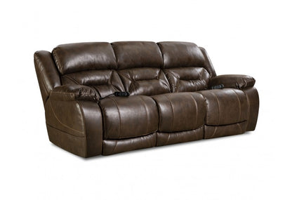 Brown reclining sofa with a remote control fastened to each arm. 